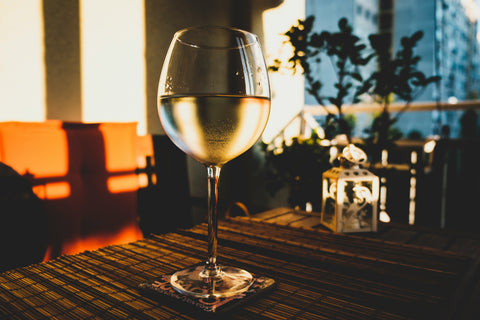 A glass of chilled Fiano white wine in a wine bar