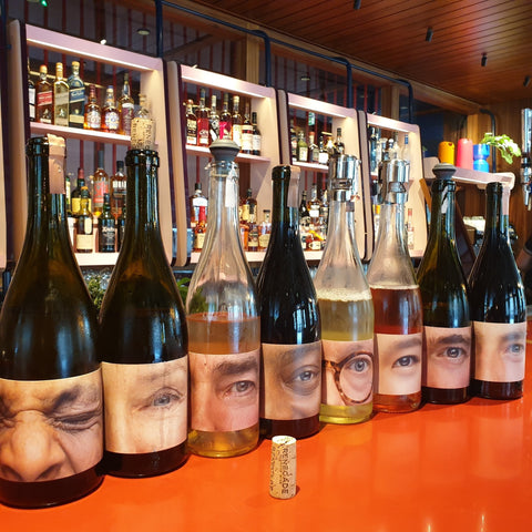 A selection of Renegades exciting wine bottles, all labelled with their namesakes eyes. 